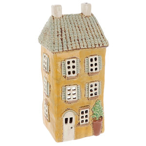 Tall Yellow Village Pottery House With Shutters