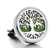 Metallic car air freshener with tree design on a white background